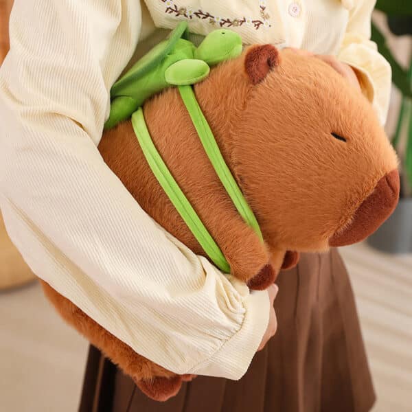 capybara plush toy held by person