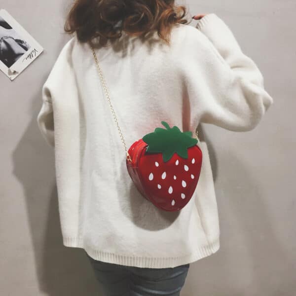 girl wearing a Strawberry Bag