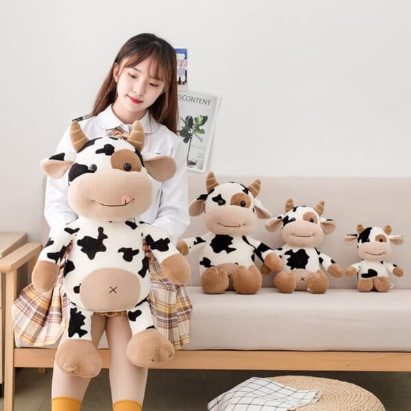 Cow Plush Toy held by woman