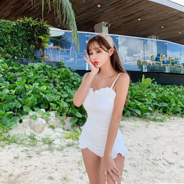 korean model wearing a Minimalistic One Piece Swimsuit