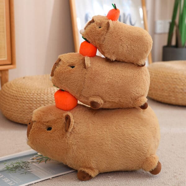 3 Capybara Plushies sitting on each other