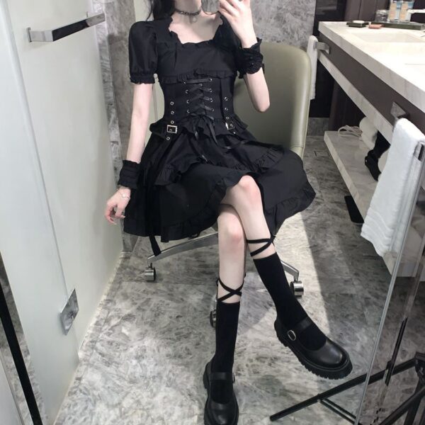 model posing on a selfie in the mirron wearing a Short Black Corset Dress with ruffles