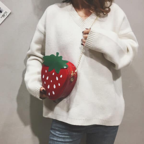 woman wearing crossbody red Strawberry Purse