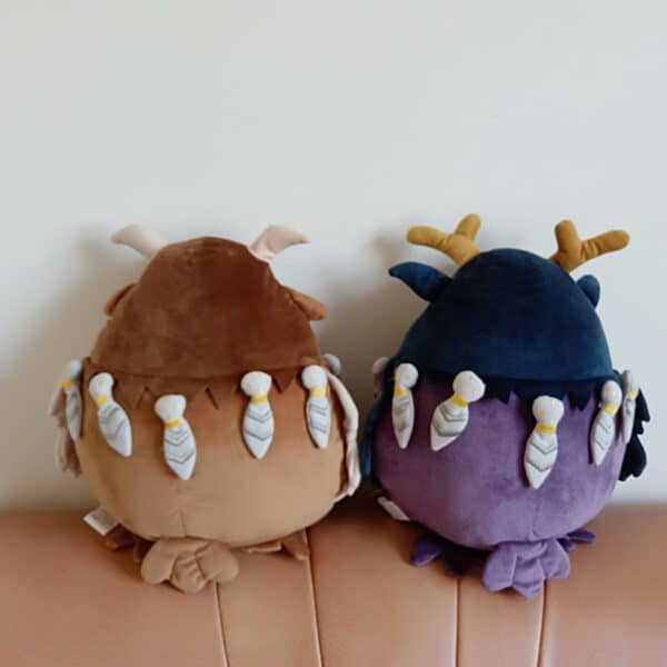 the back of 2 Owl Stuffed Animals