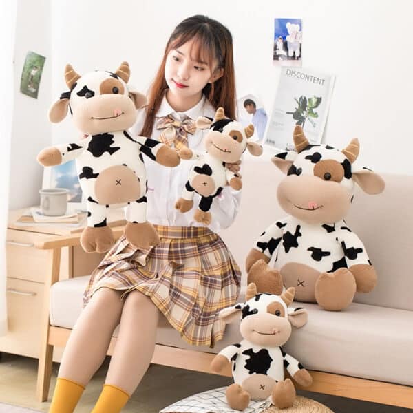 Softest Cow Plushies held by girl