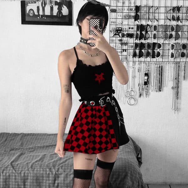 goth girl posing in goth room with her red mini goth skirt