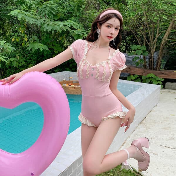 model posing wearing Pink Push Up Korean Bathing Suit One Piece